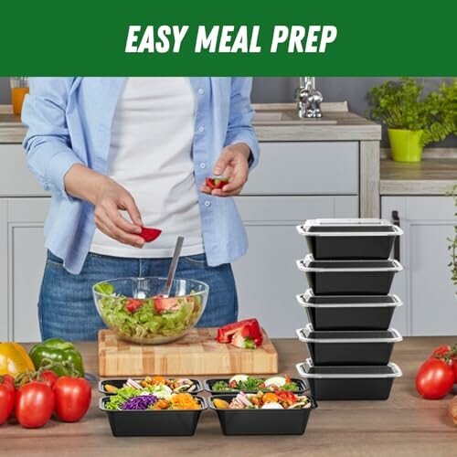 Person preparing salad with meal prep containers on kitchen counter.