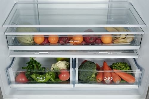 Open fridge drawers with assorted fruits and vegetables.